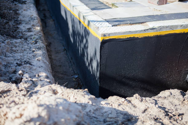 Professional Basement Waterproofing technician working in Wynnewood, PA